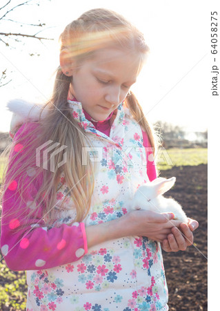 girl and rabbit girl and rabbit 64058275