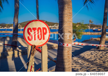 inscription STOP Corona Virus threat closes beaches and public places in many countries. The inscription STOP Corona Virus threat closes beaches and public places in many countries. The 64059007