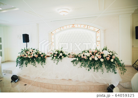 Interior of a restaurant prepared for wedding ceremony Interior of a restaurant prepared for wedding ceremony 64059325