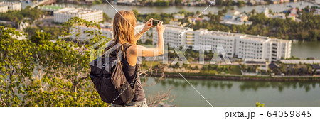 Woman tourist on the background of Nha Trang city. Travel to Vietnam Concept BANNER, LONG FORMAT Woman tourist on the background of Nha Trang city. Travel to Vietnam Concept BANNER, LONG FORMAT 64059845
