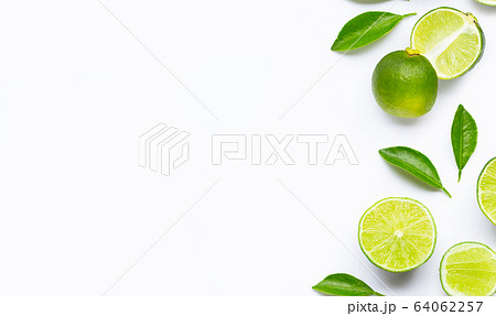 Limes with leaves isolated on white background. Limes with leaves isolated on white background. 64062257