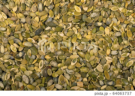 Pumpkin seeds background. Texture of seed. Healthy natural food 64063737