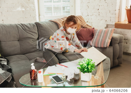 Little girl in protective mask isolated at home with coronavirus symptoms, stop epidemic 64066206