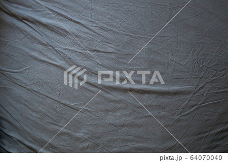 Blue themed bed sheets and pillows messed up after 64070040