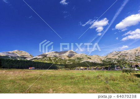 View of the village field and the Durmitor Mountains, national Park, Montenegro, Europe 64070238