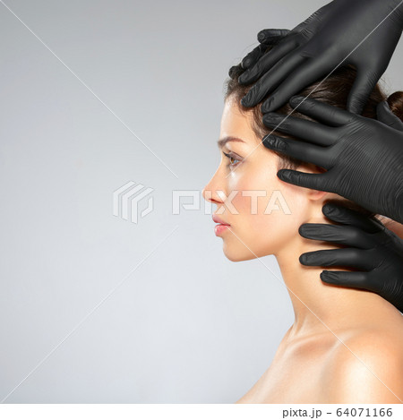 Face skin check before plastic surgery. Beautician Face skin check before plastic surgery. Beautician 64071166