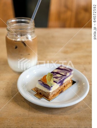 Purple taro cream cake with biscuit and ice coffee Purple taro cream cake with biscuit and ice coffee 64072592