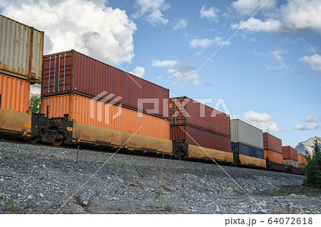 Train long freight passing with container loading Train long freight passing with container loading 64072618