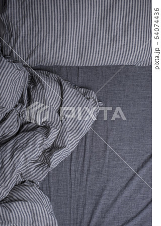 Bed with pillows and a blanket 64074436