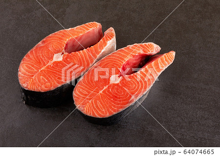 Salmon steak on black 64074665
