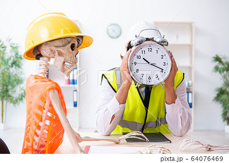 Funny construction business meeting with boss and skeletons Funny construction business meeting with boss and skeletons 64076469