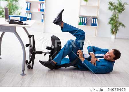 Young male employee in work accident concept Young male employee in work accident concept 64076496