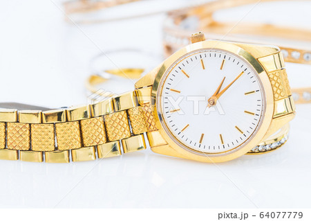 Luxury lady gold watch on white 64077779