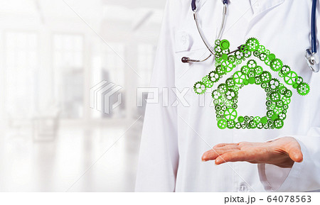 Symbol of homepage or accomodation made with cogwheels presented in female palms Symbol of homepage or accomodation made with cogwheels presented in female palms 64078563
