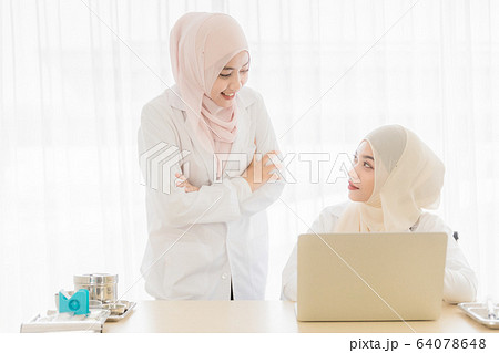 Woman doctor and muslim patient Woman doctor and muslim patient 64078648