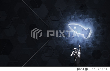 Technology idea concept with glowing rocket icon and touching it Technology idea concept with glowing rocket icon and touching it 64078784