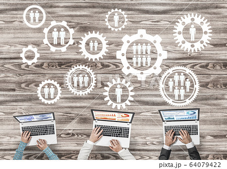 Top view of businesspeople sitting at table and using gadgets Top view of businesspeople sitting at table and using gadgets 64079422