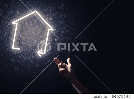 Conceptual image with hand pointing at house or main page icon o Conceptual image with hand pointing at house or main page icon o 64079546