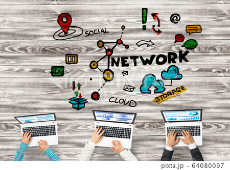 Top view of businesspeople sitting at table and using gadgets 64080097