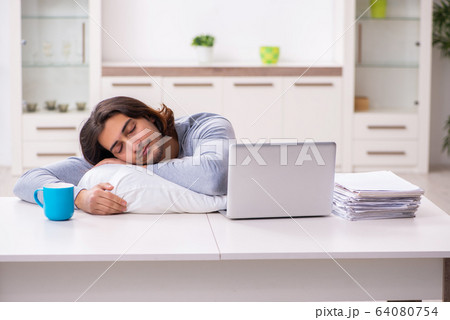 Young male employee freelancer working from home 64080754