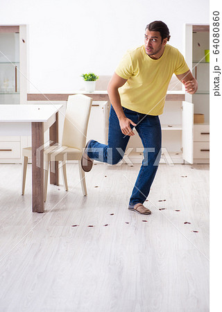 Young man and a lot of cockroaches at home Young man and a lot of cockroaches at home 64080860