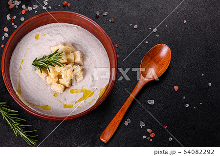 Delicious beautiful mushroom soup in a brown plate Delicious beautiful mushroom soup in a brown plate 64082292