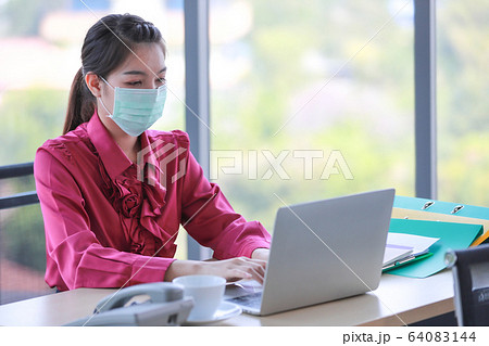 Woman wearing hygienic surgical mask. 64083144