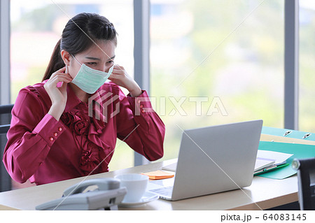 Woman wearing hygienic surgical mask Woman wearing hygienic surgical mask 64083145
