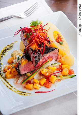 Seared Ahi Tuna Cajun style with sesame crust 64083498