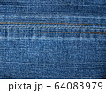 Close-up of jeans background with seams. Fabric backdrop with stitches 64083979