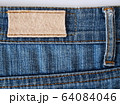 Close-up of old worn-out jeans label. 64084046