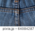 Close-up of jeans background with seams. Back seam of jeans Fabric backdrop with stitches 64084287