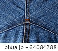 Close-up of jeans background with seams. Back seam of jeans Fabric backdrop with stitches 64084288