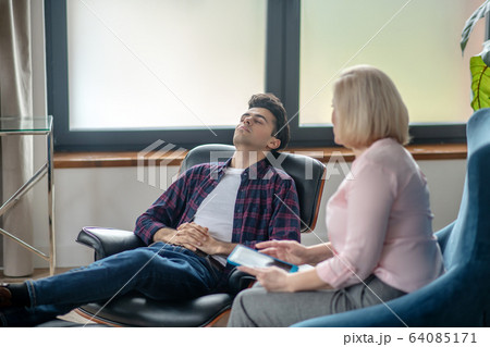 Blonde psychologist having therapy session with a patient Blonde psychologist having therapy session with a patient 64085171