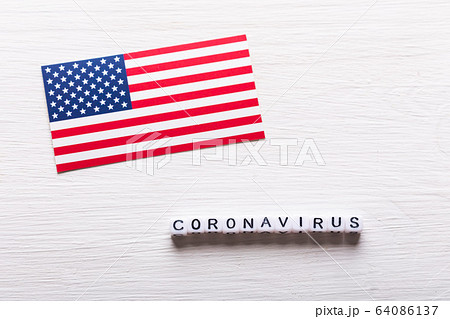 Covid-19, pandemic, quarantine and virus concept - coronavirus with american usa flag on white background. 64086137