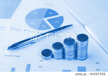 Blue theme stack of coin on chart data paper , Blue theme stack of coin on chart data paper , 64087568
