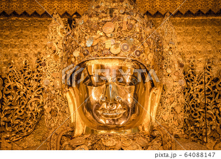 Mahamuni Buddha statue in Mahamuni temple of Mandalay, Myanmar. 64088147