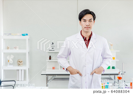Asian young handsome doctor scientist in hospital medical lap dressing white clean uniform 64088304