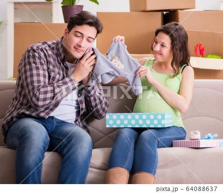 Young couple of man and pregnant wife with giftbox Young couple of man and pregnant wife with giftbox 64088637