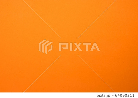 Light orange matte background of suede fabric, closeup. Velvet texture of seamless ginger woolen felt 64090211