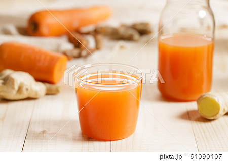 Carrots, ginger, turmeric detox fresh juice Carrots, ginger, turmeric detox fresh juice 64090407
