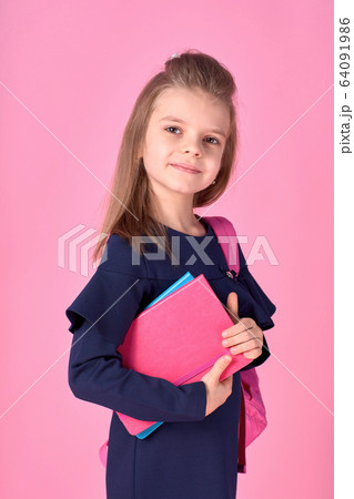 Back to school concept Half turned photo portrait of lovely confident beautiful clever girl with copybook notebook wearing school uniform dress pink bright backpack isolated 64091986