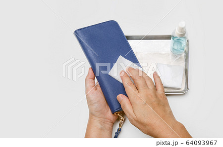 Cleaning wallet with alcohol to protection from covid-19 Cleaning wallet with alcohol to protection from covid-19 64093967