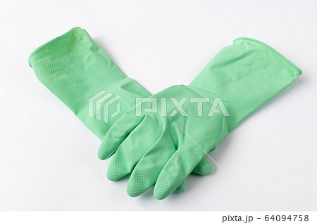 Green latex dishwashing gloves on a white background 64094758