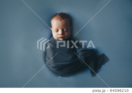 the concept of healthy lifestyle, IVF - a newborn baby sleeps under a blanket. Copy space 64096210