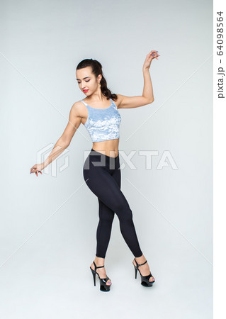 Sexy girl dancing strip on a light background. Sexy girl dancing strip on a light background. 64098564