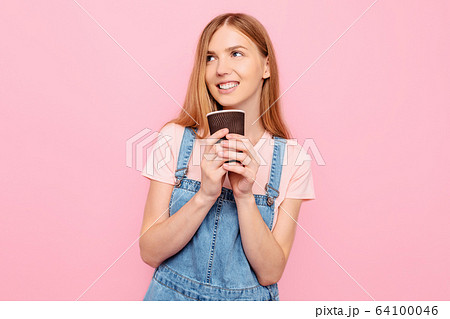 stylish young woman in casual clothes, posing with 64100046