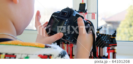 a 6 year old boy photographs his toys a 6 year old boy photographs his toys 64101208