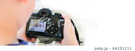 a 6 year old boy photographs his toys 64101211