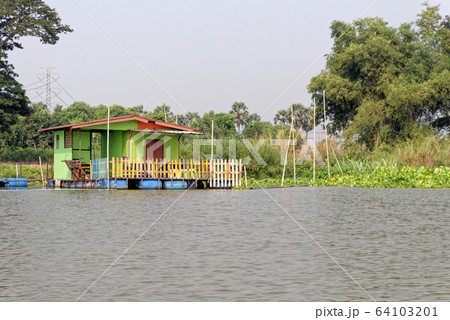 Traditional Thai house by the water Traditional Thai house by the water 64103201